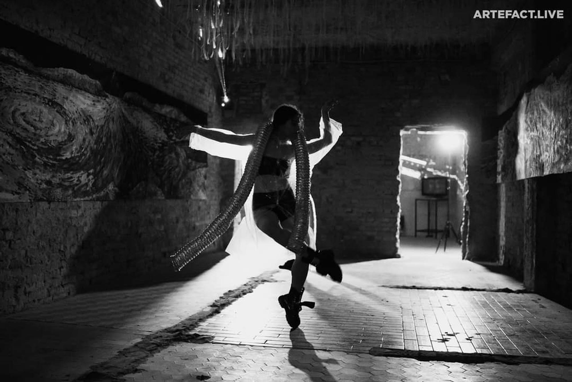 Monochrome performance in a raw architectural interior